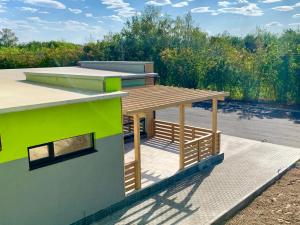 a house with a wooden deck on top of it at Hotel Vzlet in Orenburg