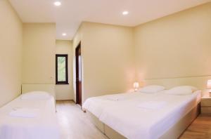 Katil atau katil-katil dalam bilik di Guest House Oxygen