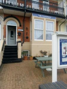 a building with a picnic table in front of it at THE CHADWICK in Skegness