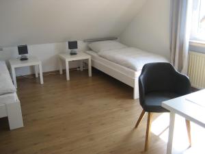 Ferienhaus Zum Talblick tesisinde bir odada yatak veya yataklar