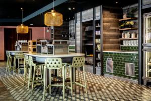 a restaurant with two tables and chairs in a room at Waterfront Southport Hotel in Southport
