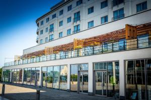 a building with a balcony on top of it at Waterfront Southport Hotel in Southport