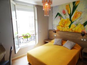 Cama ou camas em um quarto em Amélie Hotel