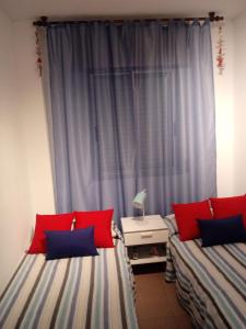 Łóżko lub łóżka w pokoju w obiekcie APARTAMENTO BEDIESTA
