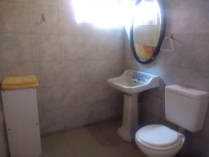 a bathroom with a sink and a toilet and a mirror at Mate de luna in Buenos Aires +14 photos