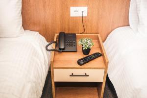 Postel nebo postele na pokoji v ubytování Sajam Garni hotel