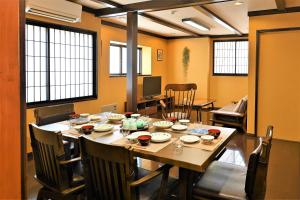 a dining room with a table and chairs at Hida-Takayama Michi in Takayama