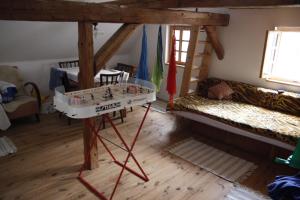 a room with a bed and bunk beds in it at Chalupa U Veverek in Mladoňov