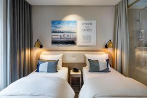Ein Bett oder Betten in einem Zimmer der Unterkunft Hotel Felix