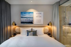 Ein Bett oder Betten in einem Zimmer der Unterkunft Hotel Felix
