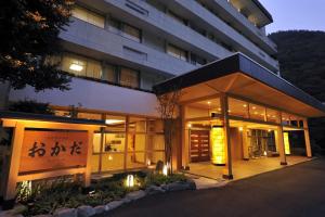 a building with a sign on the front of it at Hotel Okada in Hakone