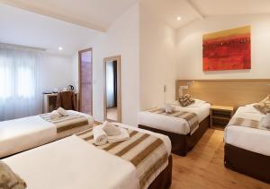 Ένα ή περισσότερα κρεβάτια σε δωμάτιο στο Holzer II +40 φωτογραφίες