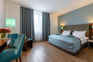 Cama ou camas em um quarto em Trip Inn Hotel Messe Westend