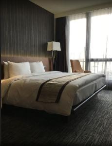 מיטה או מיטות בחדר ב-Hotel In