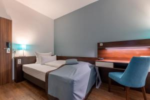 Cama ou camas em um quarto em Trip Inn Hotel Messe Westend