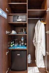 a walk in closet with a appliance in it at Trip Inn Hotel Messe Westend in Frankfurt/Main