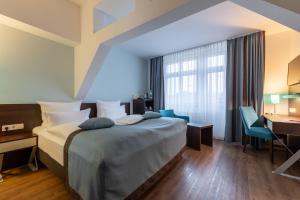 Cama ou camas em um quarto em Trip Inn Hotel Messe Westend mais 37 fotos
