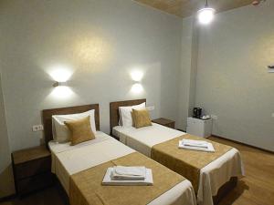 Voodi või voodid majutusasutuse Magic Hotel toas