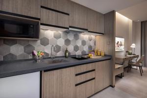 Una cocina o zona de cocina en Citadines Songshan Lake Dongguan