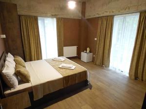 Voodi või voodid majutusasutuse Magic Hotel toas