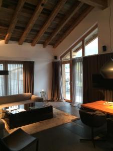 a living room with a couch and a table at Chalet Mathon in Ischgl