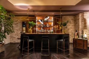 a bar in a restaurant with brick walls at Terme di Relilax Boutique Hotel & Spa in Montegrotto Terme