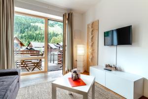 TV a/nebo společenská místnost v ubytování Quercus Appartements contactless check-in
