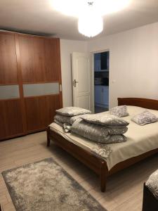 a bedroom with two beds with pillows on it at Viva Maria Apartamenty in Zakopane