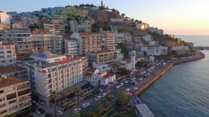 an aerial view of a city next to the ocean at Kayhanbey Hotel in Kusadası