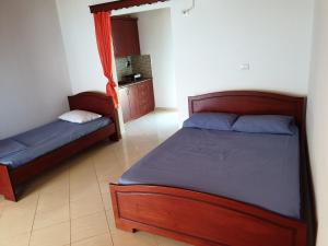 מיטה או מיטות בחדר ב-Vila Gusti