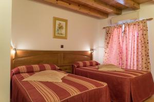 Postel nebo postele na pokoji v ubytování Hotel Jacobeo