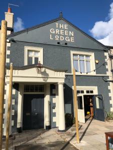 a building with a sign that reads the green lodge at Green Lodge, Wirral by Marston's Inns in Hoylake