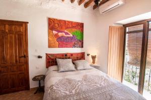 Cama o camas de una habitación en Cortijo La Caseria del Carmen