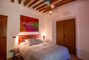 Cama o camas de una habitación en Cortijo La Caseria del Carmen