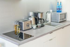 Kuchyňa alebo kuchynka v ubytovaní Apartment Flamingo 27 by Noclegi Renters