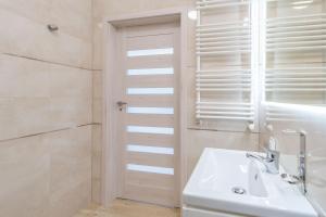 Kúpeľňa v ubytovaní Apartment Flamingo 27 by Noclegi Renters