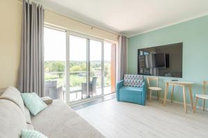 Posedenie v ubytovaní Apartment Flamingo 27 by Noclegi Renters