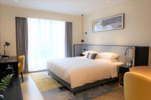 Gulta vai gultas numurā naktsmītnē Citadines Gaoke Liangjiang Chongqing