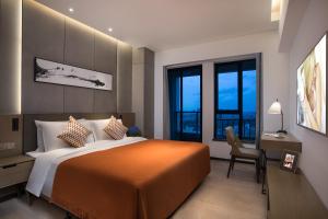 Cama o camas de una habitación en Citadines Songshan Lake Dongguan