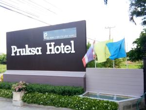 a sign for a pixas hotel with two flags at Pruksa Garden Hotel in Phu Wiang