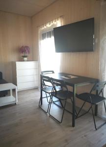 TV a/nebo společenská místnost v ubytování Delta Plius