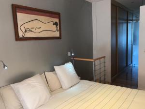 a bedroom with a bed with a picture on the wall at Old Town & River (Casco Viejo Bilbao) E-BI 1138 in Bilbao