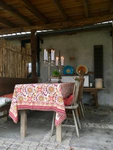 a table with a table cloth and candles on it at De Zoete Aagt in Groesbeek