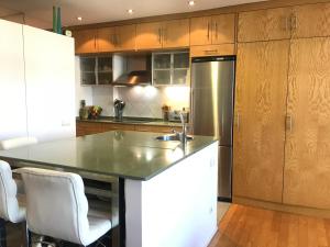 a kitchen with a stainless steel refrigerator and cabinets at Old Town & River (Casco Viejo Bilbao) E-BI 1138 in Bilbao