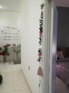 a hallway with christmas decorations on a wall at B&B Liberty in Santa Maria Capua Vetere