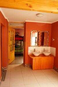 a bathroom with a sink, toilet and tub at Hostal Campo Base in San Pedro de Atacama