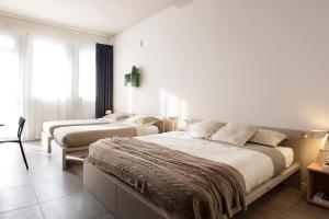 Postel nebo postele na pokoji v ubytování Casa a Colori Padova
