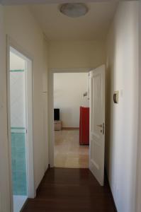 an empty hallway with a door and a room at A casa dalla Fra 2 in Castelfranco Emilia