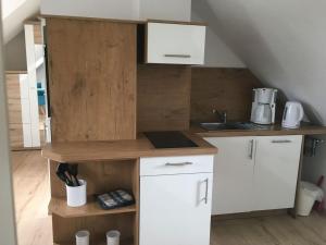 Kuchyň nebo kuchyňský kout v ubytování Appartement & Pension Schmidt Kosma + 4 fotografie