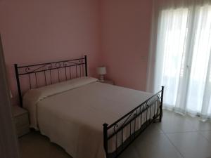 Posteľ alebo postele v izbe v ubytovaní L'elicriso B&B